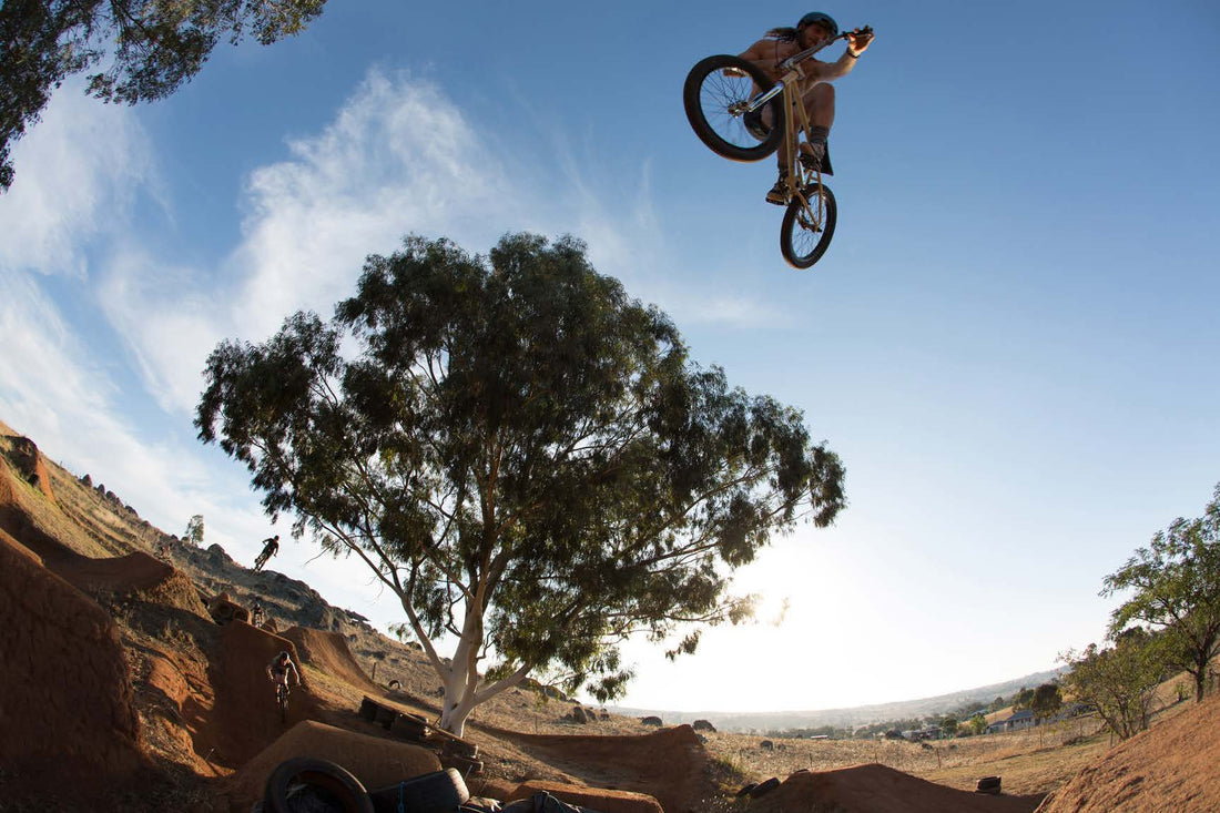 Chris Harti throwing a pull-back whip over the trails on his Fit Hartbreaker