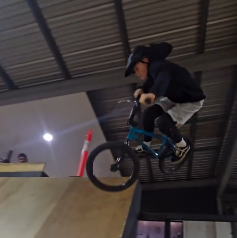 BMX rider jumping at Village Skatepark during Stylecat Coaching